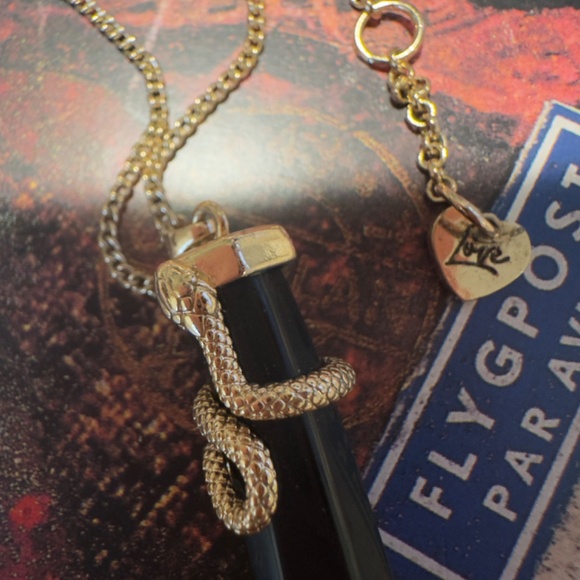 Gold tone snake pendant necklace on black onyx point.   Aldo tag on chain. - Picture 3 of 5